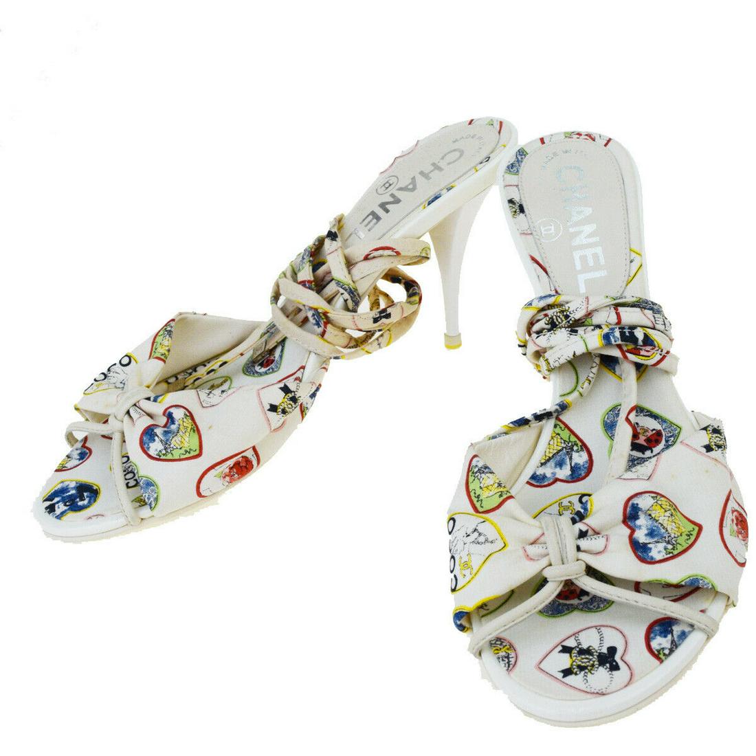 Authentic CHANEL Patent Leather,Canvas Sandals: Brand: CHANEL Material: Patent Leather,Canvas Style: Sandals Color: Ivory Size: 37 Size(inch): Sole(Lenght) 9.4 x H 3.1 x D 0 "(approx.) Country of Origin: Italy Come with: - All Bidhaus items come wi