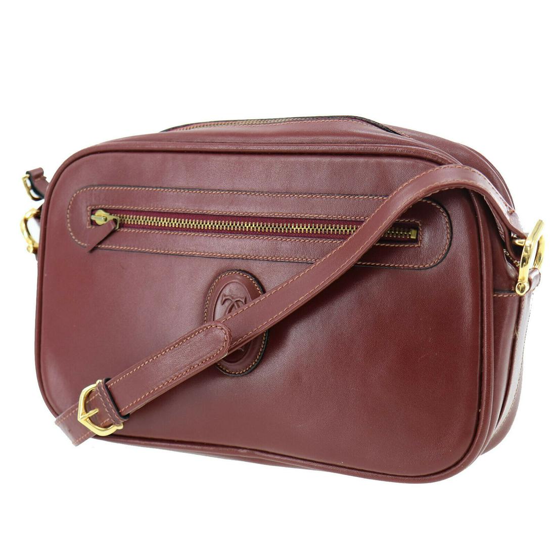 Authentic CARTIER Leather Shoulder Bag: Brand: CARTIER Material: Leather Style: Shoulder Bag Color: Bordeaux Size(Inch): H 7.0 x D 2.3 x L 10.6 Shoulder : 36.8 - 40.5 Country of Origin: Italy All Bidhaus items come with a 100% money-back au