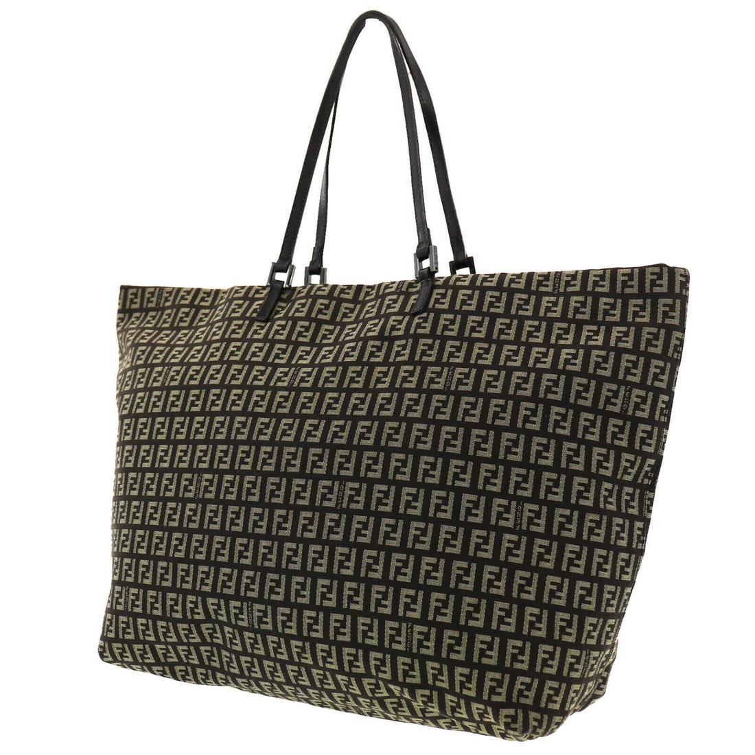Authentic FENDI VINTAGE Canvas Tote: Brand: FENDI Material: Canvas Style: Tote Color: Brown Size(Inch): H 12.4 x D 5.9 x L 13.7 Shoulder : 18.8 Country of Origin: Italy Come with: All Bidhaus items come with a 100% money-back authenticit