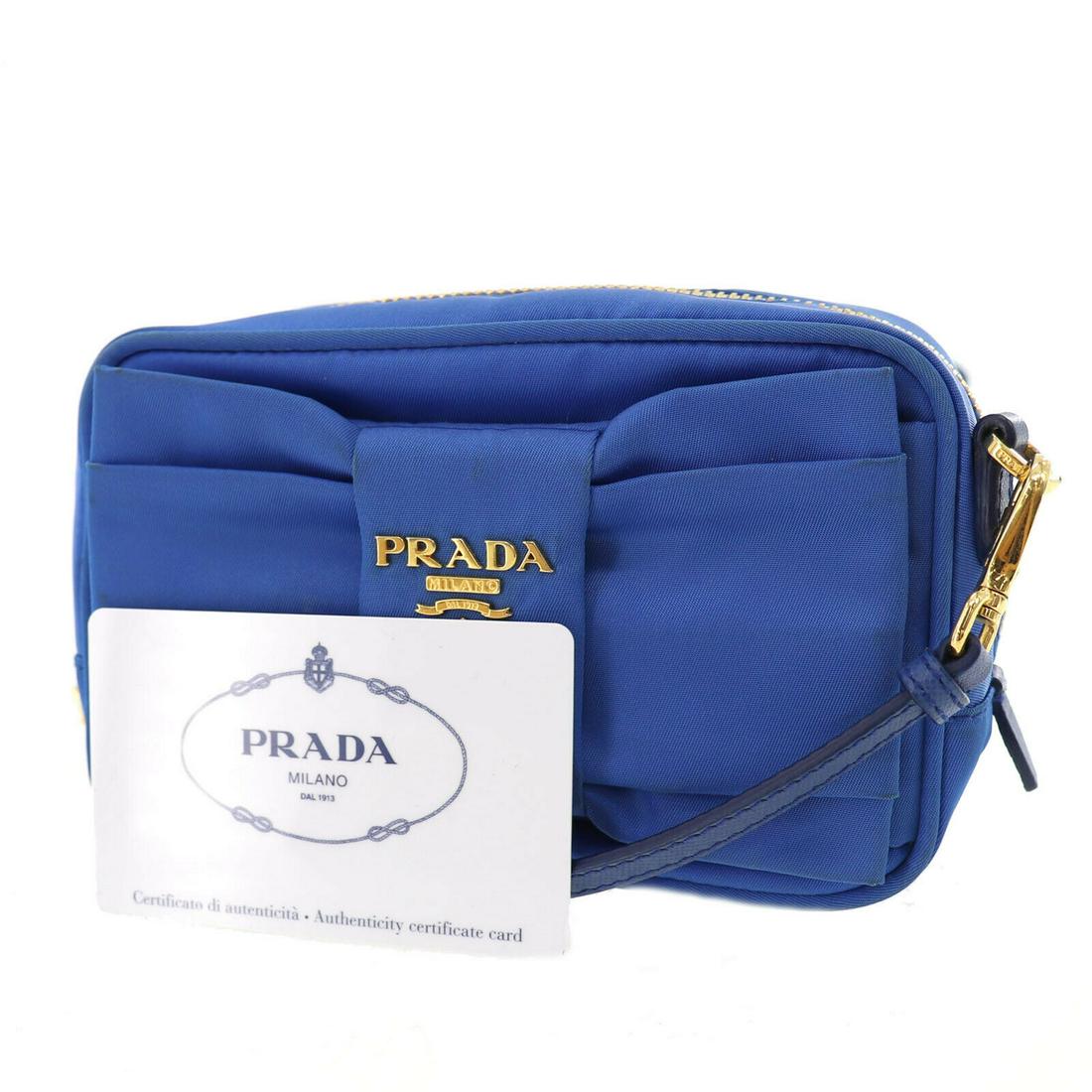Authentic PRADA Nylon Shoulder Bag: Brand: PRADA Material: Nylon Style: Shoulder Bag Color: Blue Size(Inch): H 3.5 x D 1.7 x L 5.5 Shoulder : 49.6 - 55.9 Country of Origin: Italy Come with:Authenticity Card All Bidhaus items come with a