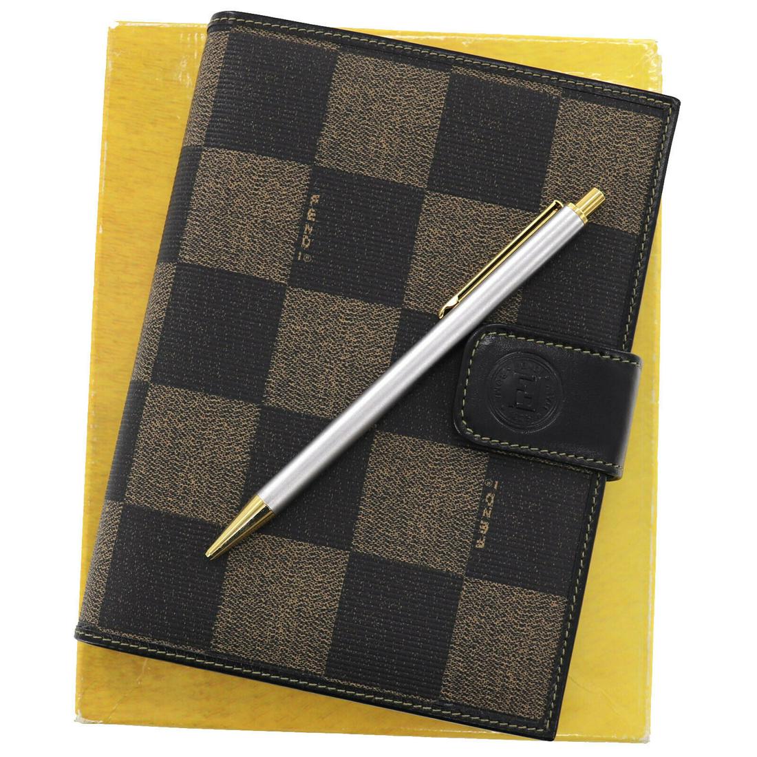 Authentic FENDI VINTAGE: Brand: FENDI Material: PVC Leather Color: Black, Brown Size(Inch): H 6.6 x D 1.1 x L 5.1 Country of Origin: Italy Come with: Pen Box All Bidhaus items come with a 100% money-back authenticity guarante