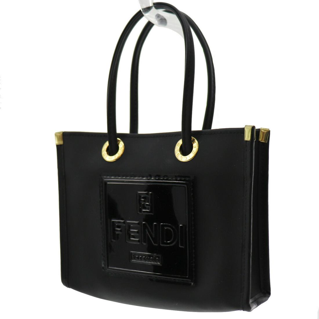 Authentic FENDI MINI Rubber Pouch: Brand: FENDI Material: Rubber Style: Pouch Color: Black Size(Inch): H 4.3 x D 1.7 x L 6.1 Handle:5.9 Country of Origin: Unknown All Bidhaus items come with a 100% money-back authenticity guarantee. Pl