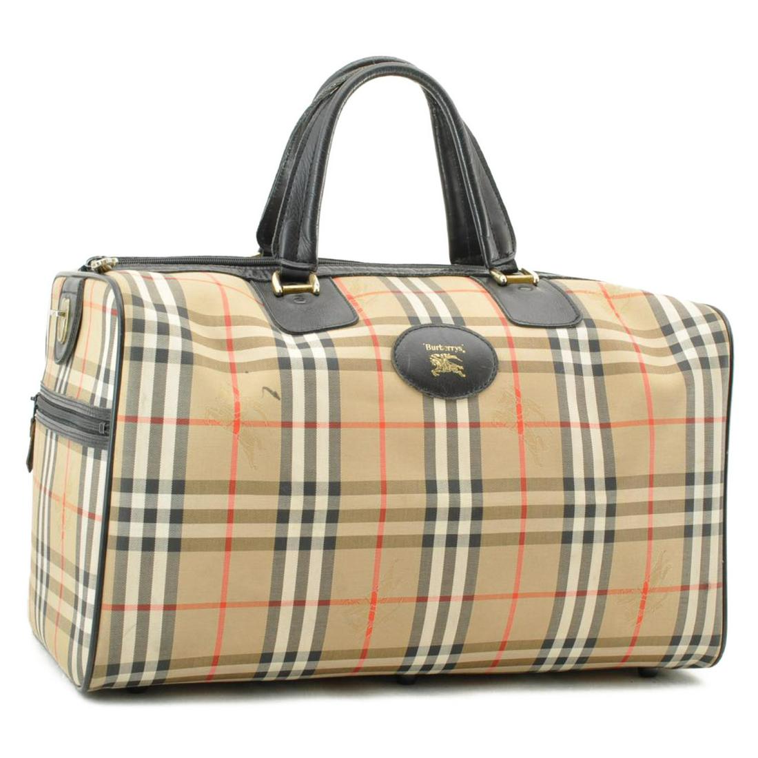 Authentic BURBERRYS Canvas Boston bag: Brand: BURBERRYS Material: Canvas Style: Boston bag Color: Beige Size(inch): W18.11 x H9.05 x D10.23inch(Approx) Country of Origin: â€“ Accessory: Key All Bidhaus items come with a 100% money-bac