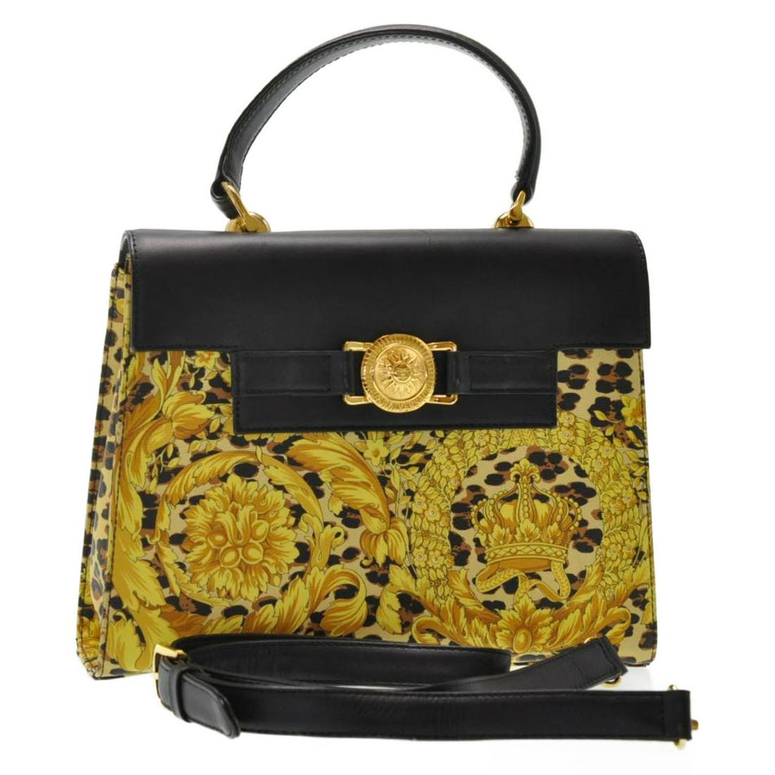 Authentic GIANNI VERSACE PVC Leather Hand Bag: Brand: GIANNI VERSACE Material: PVC Leather Style: Hand Bag Color: Black / Yellow Size(inch): W10.23 x H8.66 x D2.75â€³ / Shoulder Drop 17.32-20.47â€³(Approx) Country of Origin: â€“ Acces