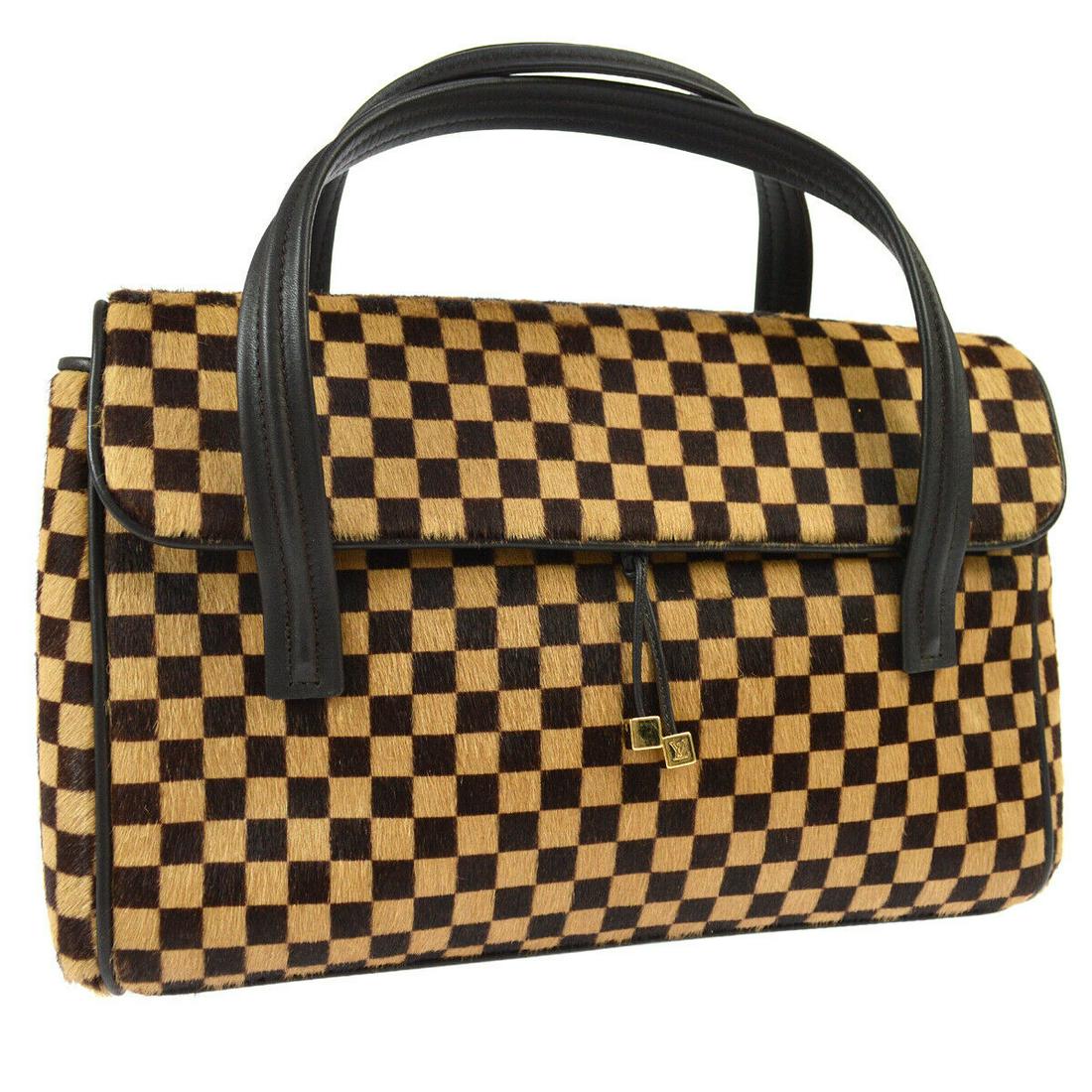 Authentic LOUIS VUITTON Fur, Leather Hand Bag: Brand: LOUIS VUITTON Material: Fur, Leather Style: Hand Bag Color: Brown Size(inch): W10.2 x H7.5 x D3.1 " / Strap Drop: 2.8 Size(inch): W 10.2 x H 7.5 x D 3.1 " Handle Drop. 2.8 " Country of Origin: