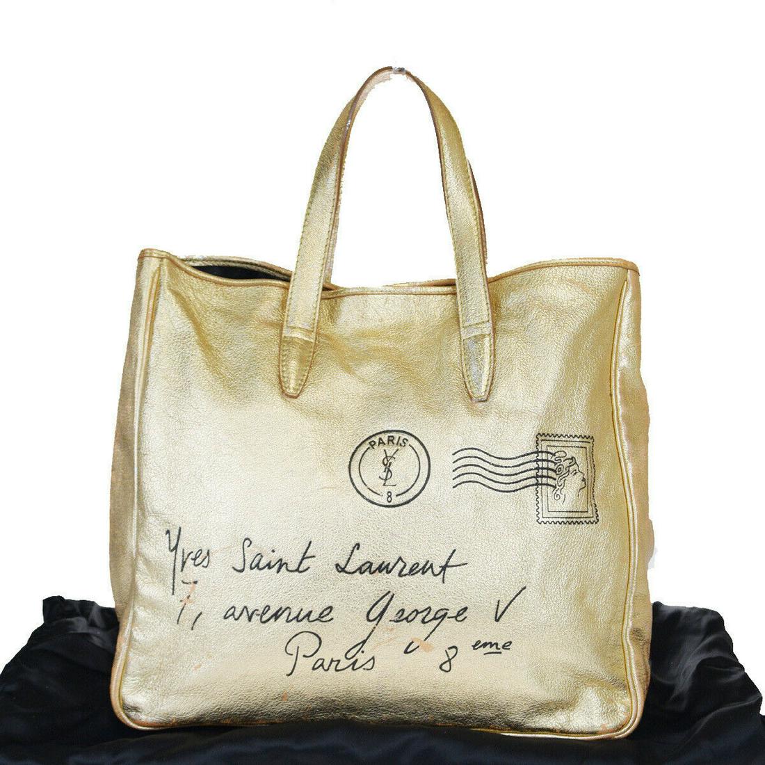 Authentic YVES SAINT LAURENT Leather Tote bag: Brand: YVES SAINT LAURENT Material: Leather Style: Tote bag Color: Gold Size (HxWxD): 34cm x 34cm x 15cm / 13.38'' x 13.38'' x 5.9'' Country of Origin: Italy All Bidhaus items come with a 100% money-b
