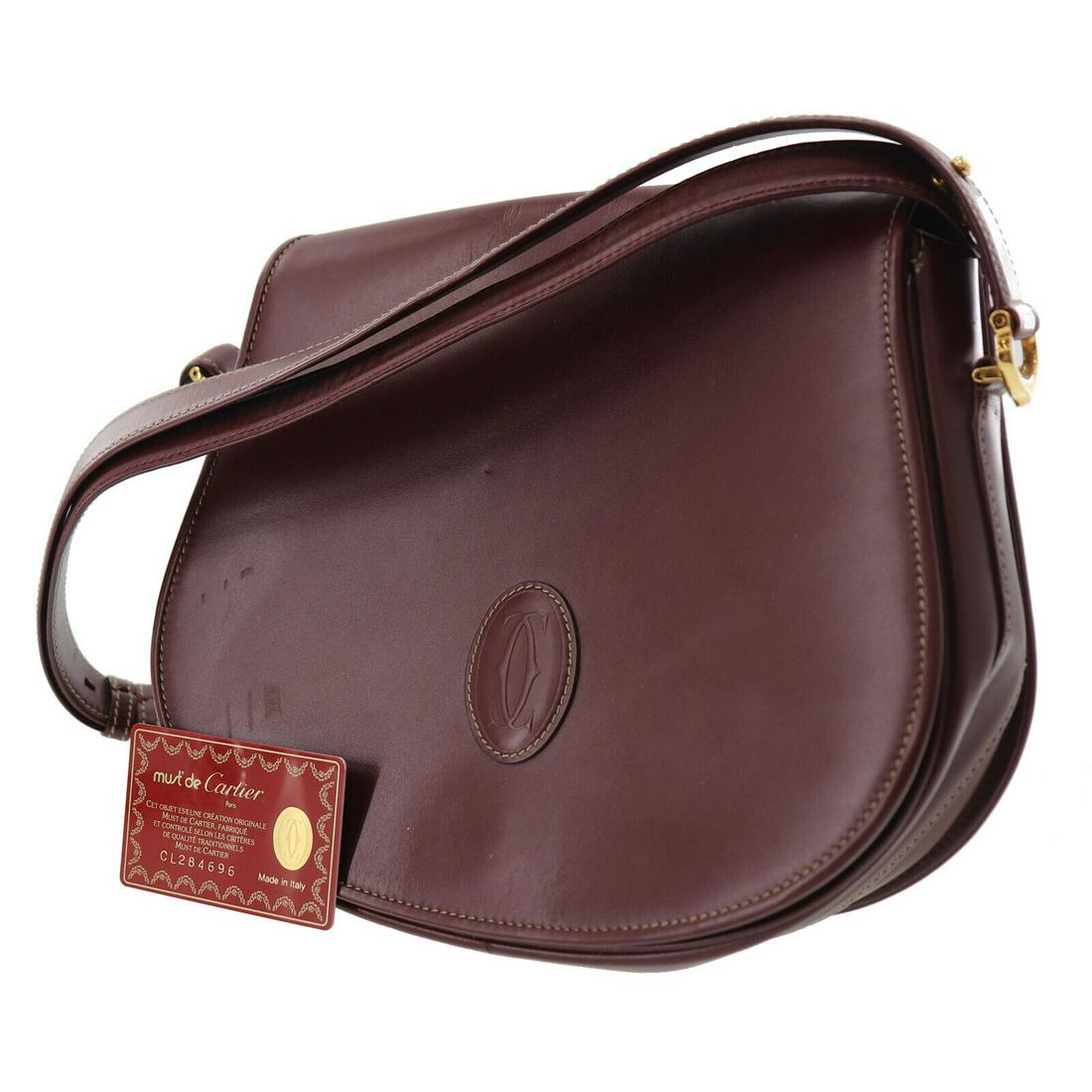Authentic CARTIER Leather Shoulder Bag: Brand: CARTIER Material: Leather Style: Shoulder Bag Color: Bordeaux Size(Inch): H 9.2 x D 2.5 x L 10.6 Shoulder.27.5-43.1 Country of Origin: Italy All Bidhaus items come with a 100% money-back authen