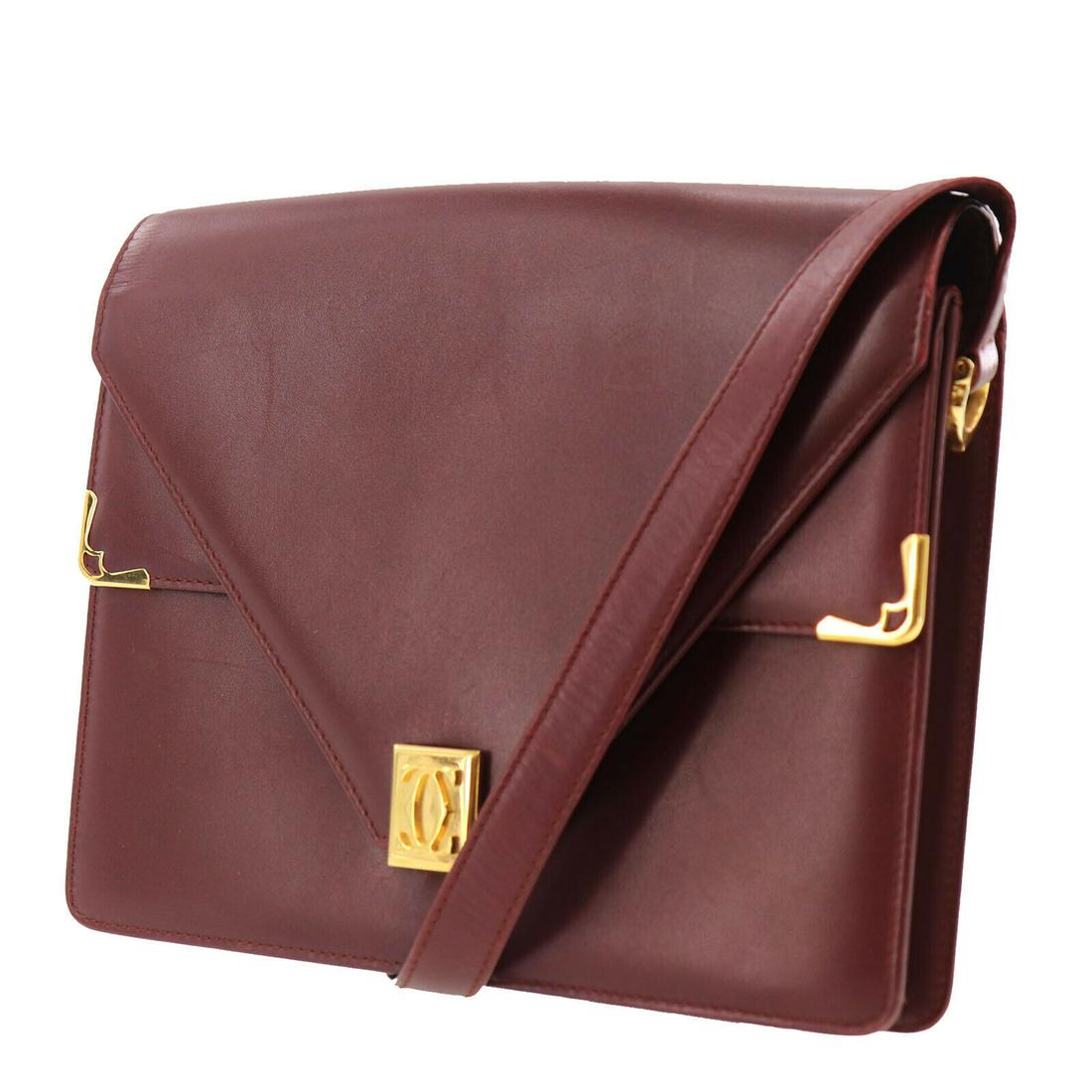 Authentic CARTIER Leather Shoulder Bag: Brand: CARTIER Material: Leather Style: Shoulder Bag Color: Bordeaux Size(Inch): H 7.2 x D 1.1 x L 9.4 Shoulder : 38.5 - 43.3 All Bidhaus items come with a 100% money-back authenticity guarantee. ALL 