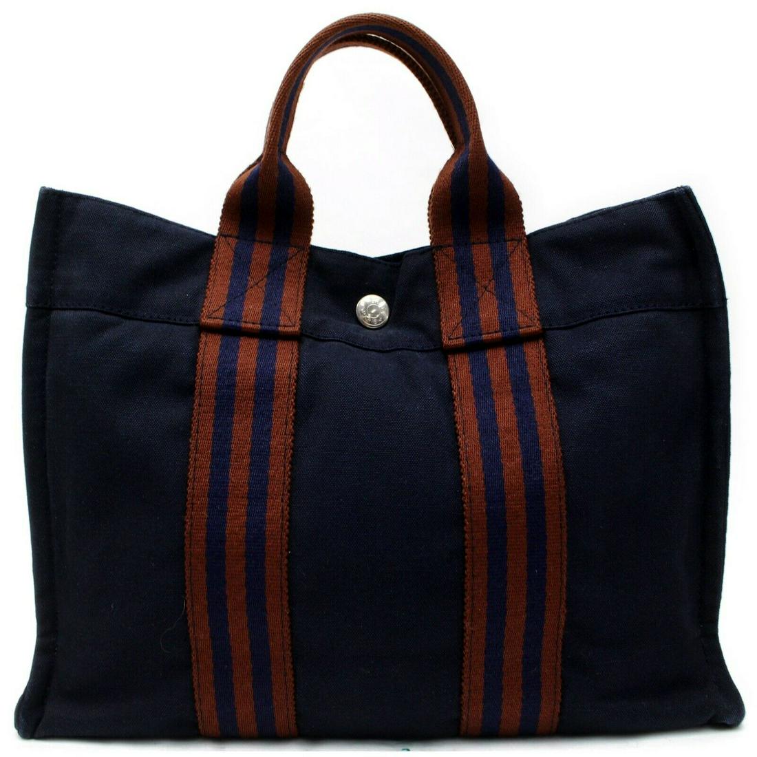 Authentic HERMES Canvas Tote Bag: Brand: HERMES Material: Canvas Style: Tote Bag Color: Navy Blue Size(inch): W11.8 inch(approx) /30 cm(approx) x H8.66 inch(approx) /22 cm(approx) x D2.36 inch(approx) /6 cm(approx) " Country of Origin
