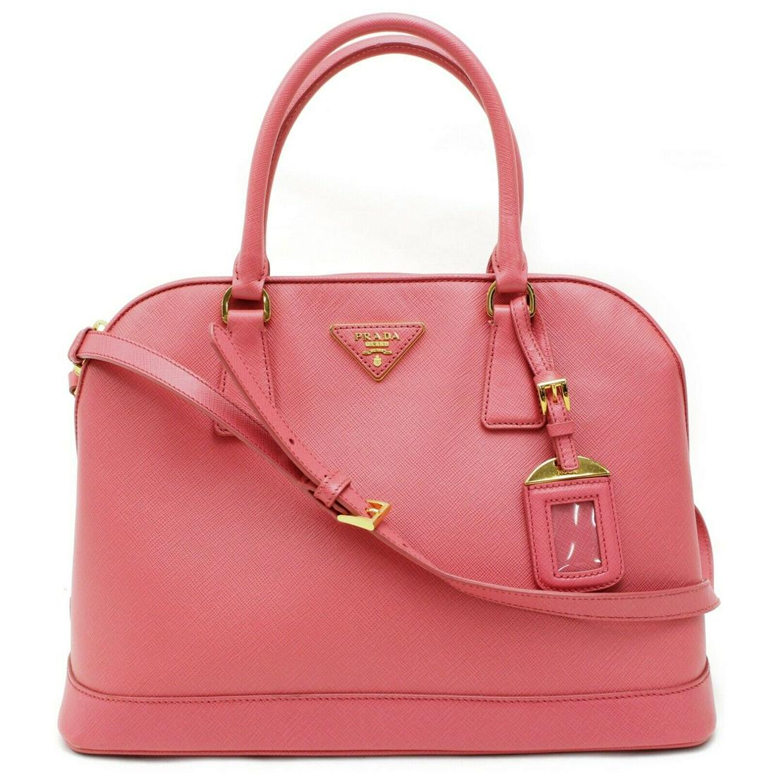 Authentic PRADA Saffiano Leather Hand Bag: Brand: PRADA Material: Saffiano Leather Style: Hand Bag Color: Pinks Size(inch): W12.5 inch(approx) /32 cm(approx) x H8.66 inch(approx) /22 cm(approx) x D5.51 inch(approx) /14 cm(approx) " / Strap Dro