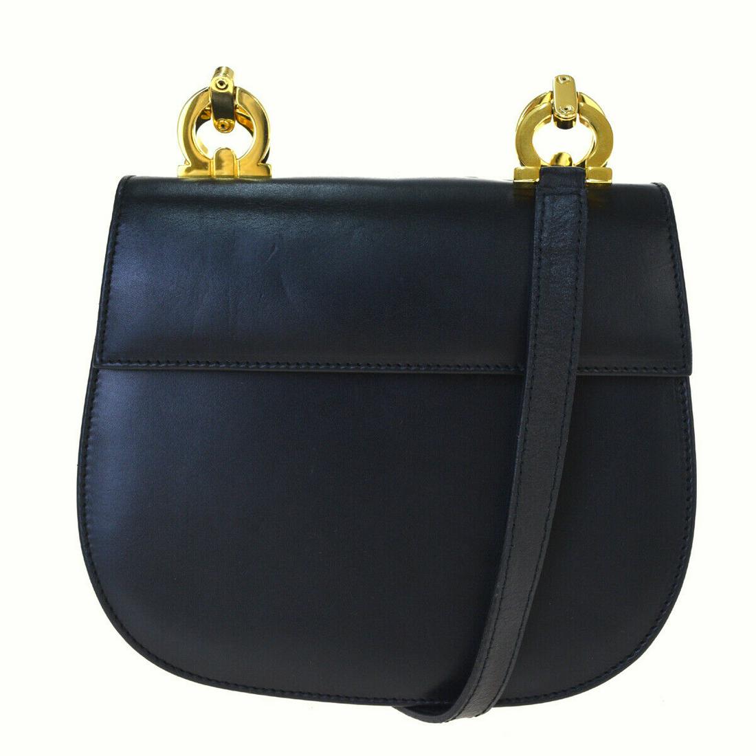 Authentic SALVATORE FERRAGAMO Leather Shuoulder Bag: Brand: SALVATORE FERRAGAMO Material: Leather Style: Shuoulder Bag Color: Black Size(inch): W 7.1 x H 5.1 x D 2.8 "(approx.) Country of Origin: Italy Come with: - All Bidhaus items come with a 100% mon