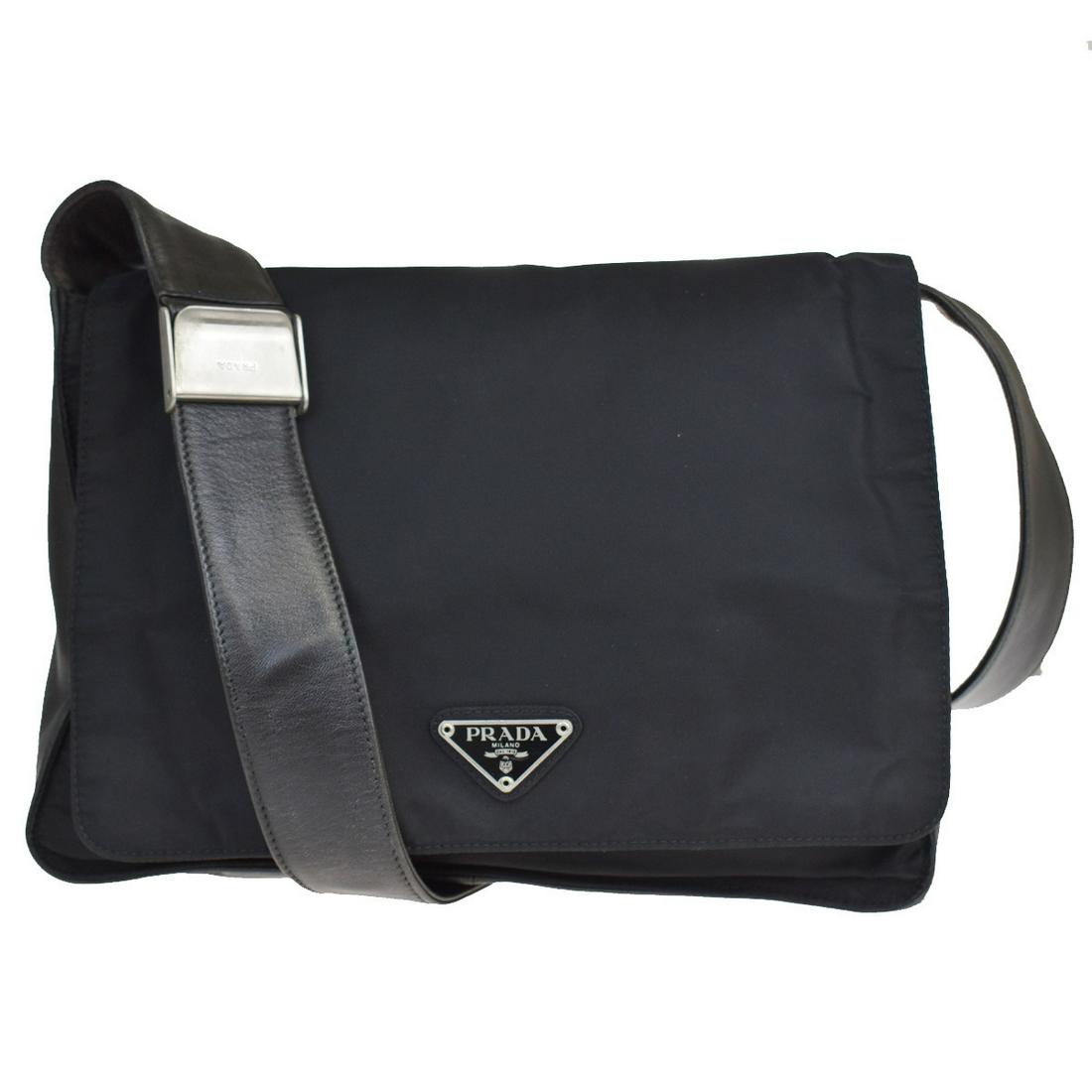 Authentic PRADA Nylon, Leather Shoulder bag: Brand: PRADA Material: Nylon, Leather Style: Shoulder bag Color: Black Size (HxWxD): 18cm x 27cm x 8cm / 7.08'' x 10.62'' x 3.14'' Country of Origin: Italy All Bidhaus items come with a 100% money-bac