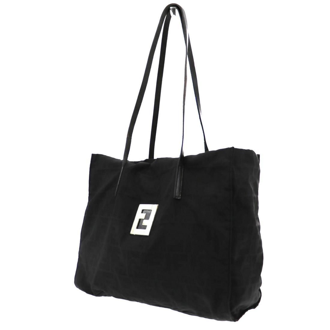 Authentic FENDI VINTAGE Nylon Canvas Hand Bag: Brand: FENDI Material: Nylon Canvas Style: Hand Bag Color: Black Size(Inch): H 10.2 x D 3.9 x L 12.2 Handle.12.5 Country of Origin: Italy Come with: - All Bidhaus items come with a 100% money-back aut