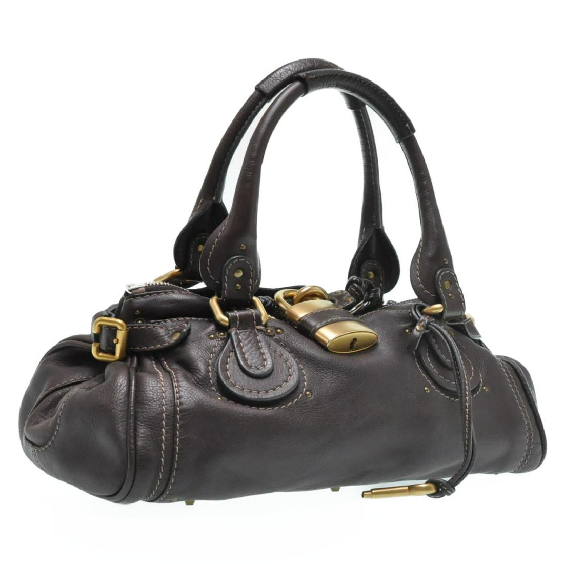 Authentic CHLOE Leather Hand Bag: Brand: CHLOE Material: Leather Style: Hand Bag Color: Dark Brown Size(inch): W13.77 x H5.9 x D6.69inch(Approx) Country of Origin: Italy Accessory: Padlock / Key All Bidhaus items come with a 100% mone