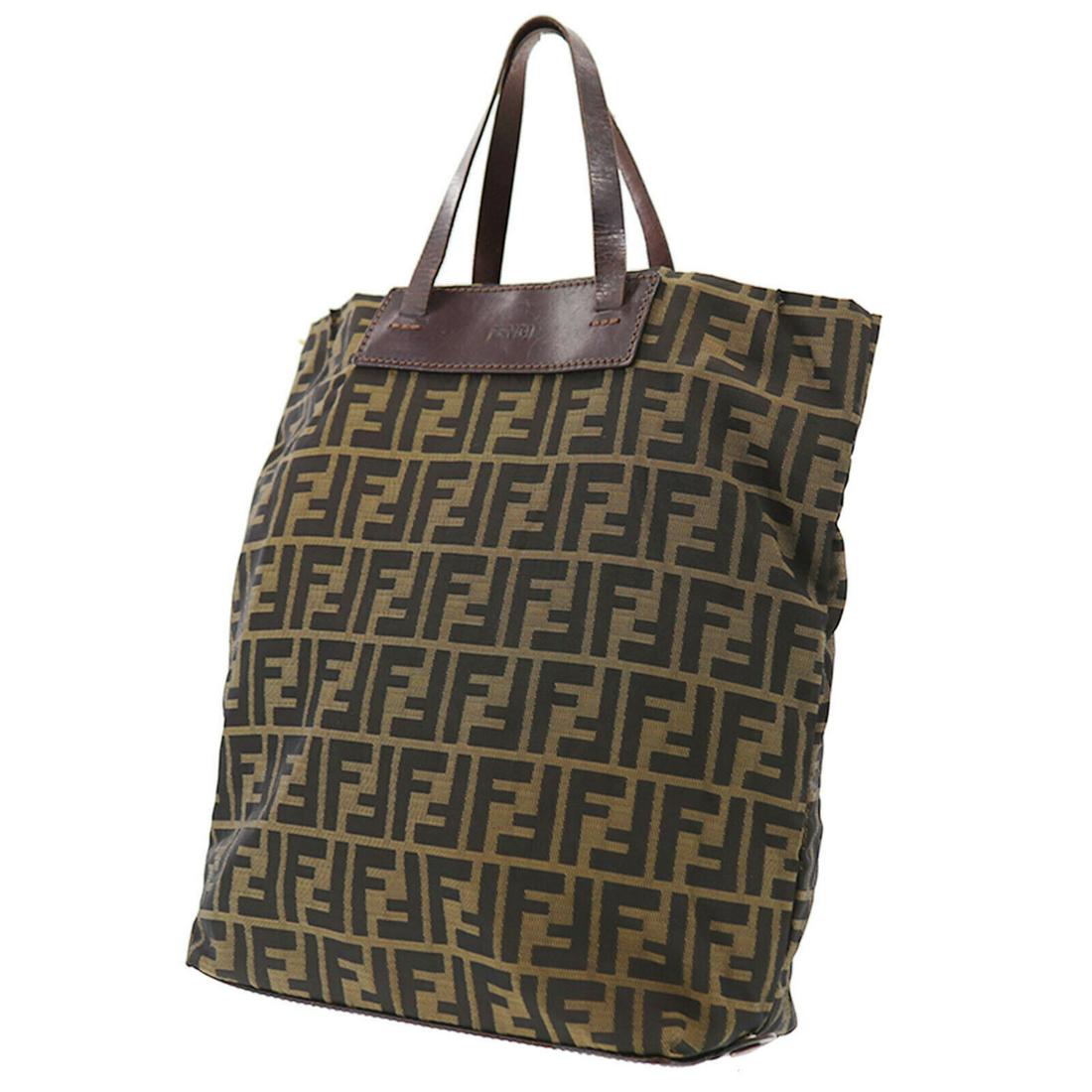 Authentic FENDI VINTAGE Nylon, Leather Hand Bag: Brand: FENDI Material: Nylon, Leather Style: Hand Bag Color: Brown Size(Inch): H 13.7 x D 3.9 x L 10.2 Handle: 11.0 Country of Origin: Italy Come with: - All Bidhaus items come with a 100% money-back 
