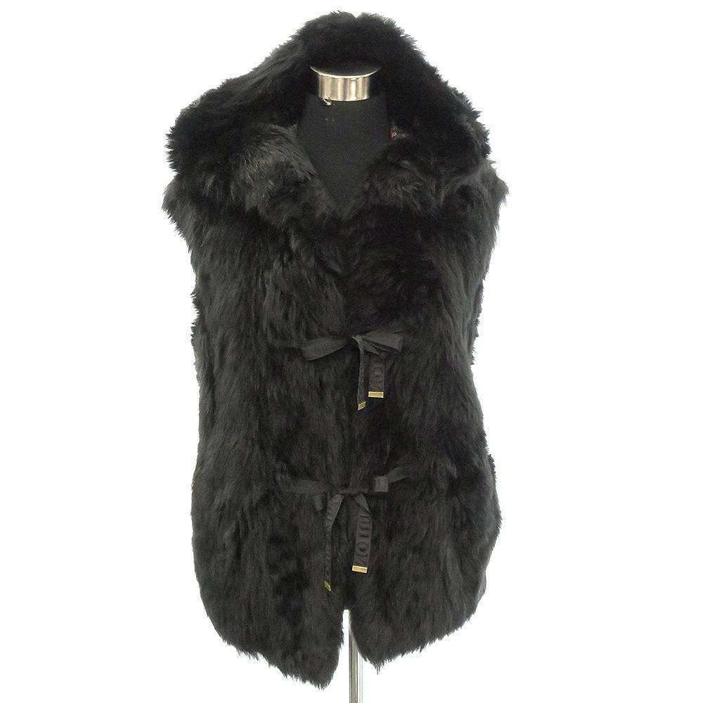 Authentic LOUIS VUITTON Lamb Fur Vest: Brand: LOUIS VUITTON Material: Lamb Fur Style: Vest Color: Black Size: 34 All Bidhaus items come with a 100% money-back authenticity guarantee. ALL SALES ARE FINAL. Please refer to images carefully fo