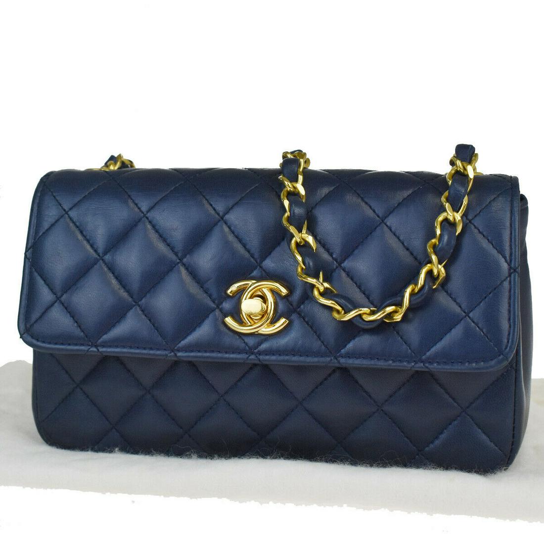 Authentic CHANEL Leather Shoulder Bag: Brand: CHANELMaterial: LeatherStyle: Shoulder BagColor: Navy BlueSize(inch): W 7.1 x H 4.3 x D 2 "(approx.)Country of Origin: -Come with: Dust bag,All Bidhaus items come with a 100% money-back authent