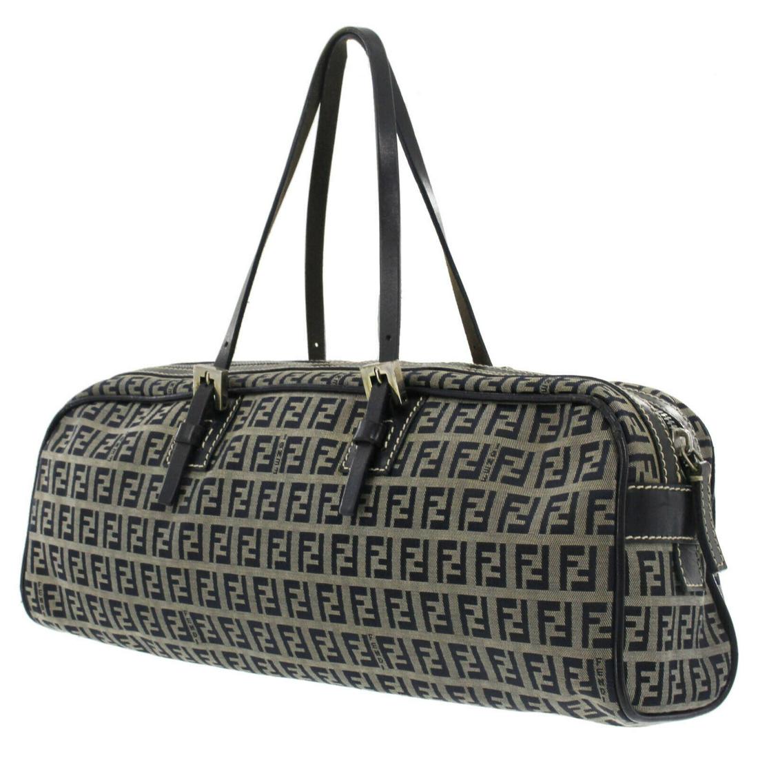 Authentic FENDI VINTAGE Canvas Hand Bag: Brand: FENDIMaterial: CanvasStyle: Hand BagColor: NavySize(Inch): H 5.9 x D 3.5 x L 14.9Handle. 14.9-13.3Country of Origin: ItalyCome with: -All Bidhaus items come with a 100% money-back authenticity 