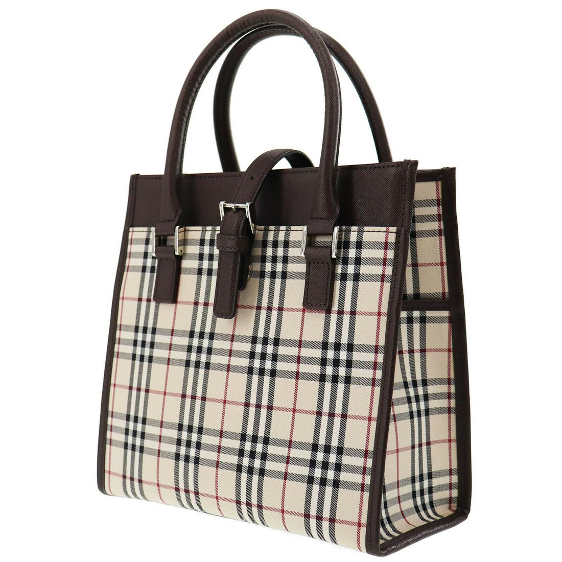 Authentic BURBERRY Canvas, Leather Hand Bag: Brand: BURBERRYMaterial: Canvas, LeatherStyle: Hand BagColor: Beige BrownSize(Inch): H 9.0 x D 4.1 x L 9.0Handle: 16.5Come with: -All Bidhaus items come with a 100% money-back authenticity guarantee.