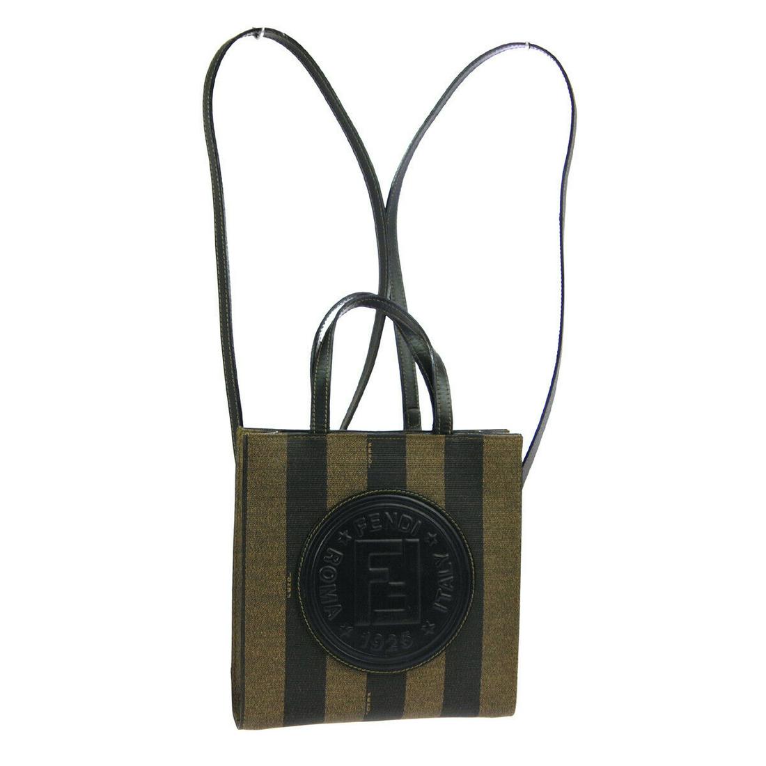 Authentic FENDI BACKPACK PVC, Leather 3way Bag: Brand: FENDIMaterial: PVC, LeatherStyle: 3way BagColor: Brown, BlackSize(inch): W7.9 x H8.3 x D2.0 " / Strap Drop: 3.9 or 15.4Country of Origin: ItalyCome with: Spare strapAll Bidhaus items come with 
