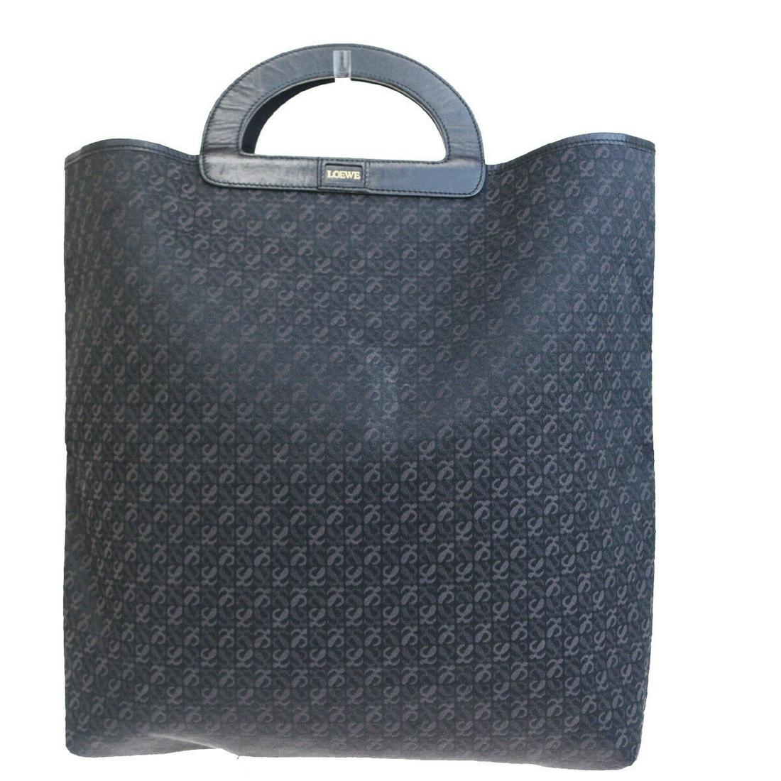 Authentic LOEWE Canvas, Leather Hand Bag: Brand: LOEWEMaterial: Canvas, LeatherStyle: Hand BagColor: BlackSize(inch): W 12.2 x H 13.8 x D 3.5 "(approx.)Country of Origin: SpainCome with: -All Bidhaus items come with a 100% money-back authenti