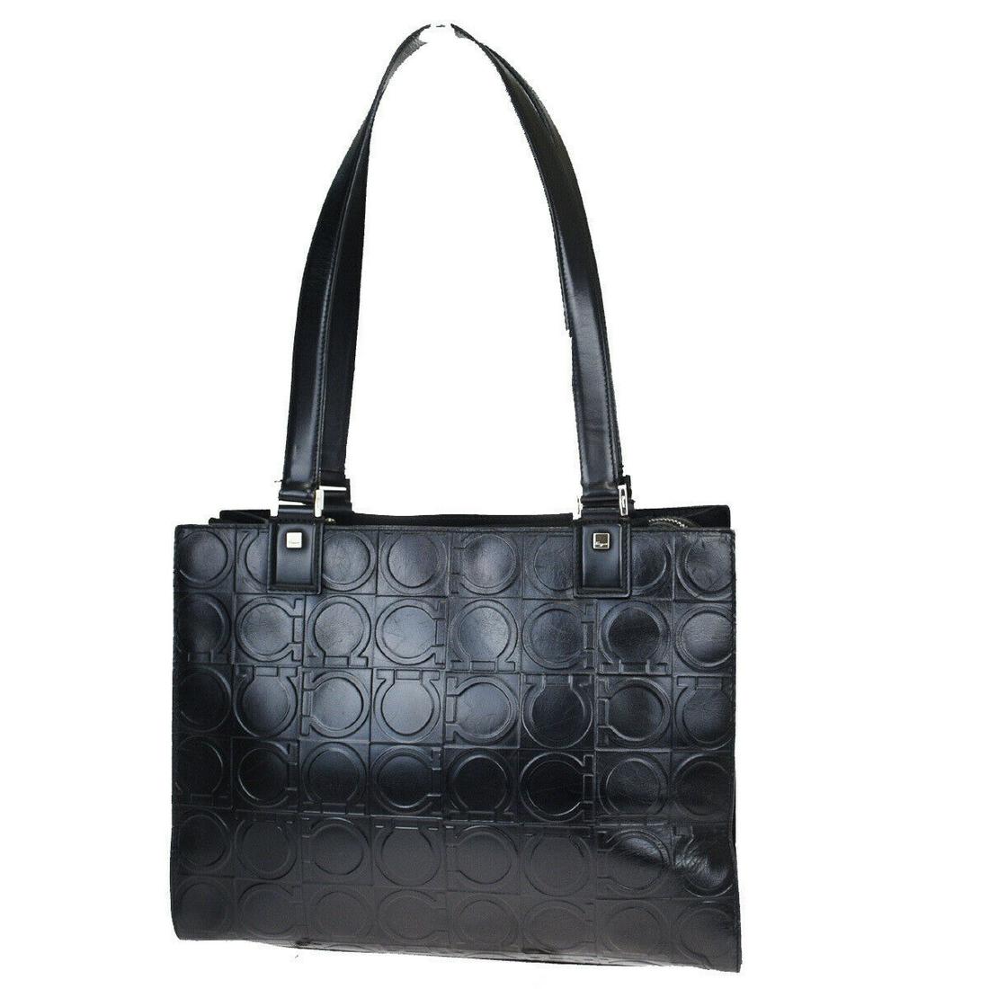 Authentic SALVATORE FERRAGAMO Leather Tote bag: Brand: SALVATORE FERRAGAMOMaterial: LeatherStyle: Tote bagColor: BlackSize (HxWxD): 22cm x 31cm x 14cm / 8.66'' x 12.2'' x 5.51''Country of Origin: ItalyAll Bidhaus items come with a 100% money-back a