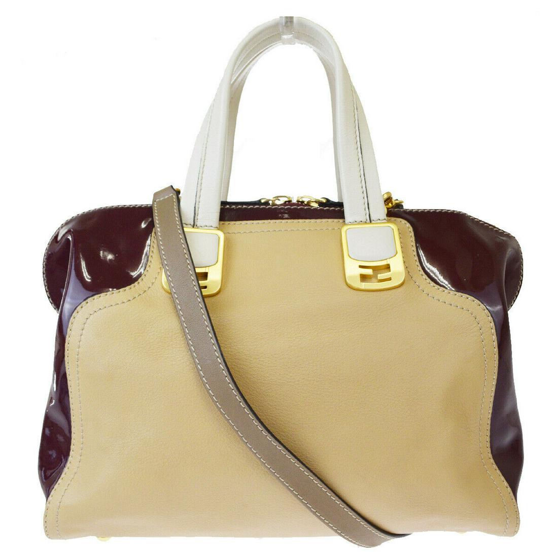 Authentic FENDI Leather, Patent Leather Shoulder Hand: Brand: FENDIMaterial: Leather, Patent LeatherStyle: Shoulder Hand BagColor: Beige.BordeauxSize(inch): W 11.8 x H 9.8 x D 5.5 "(approx.)Country of Origin: ItalyCome with: Shoulder strapAll Bidhaus item