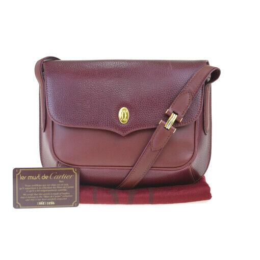 Authentic CARTIER Leather Shoulder bag: Brand: CARTIERMaterial: LeatherStyle: Shoulder bagColor: BordeauxSize (HxWxD): 17cm x 23.5cm x 4.5cm / 6.69'' x 9.25'' x 1.77''Country of Origin: UnknownAll Bidhaus items come with a 100% money-back a