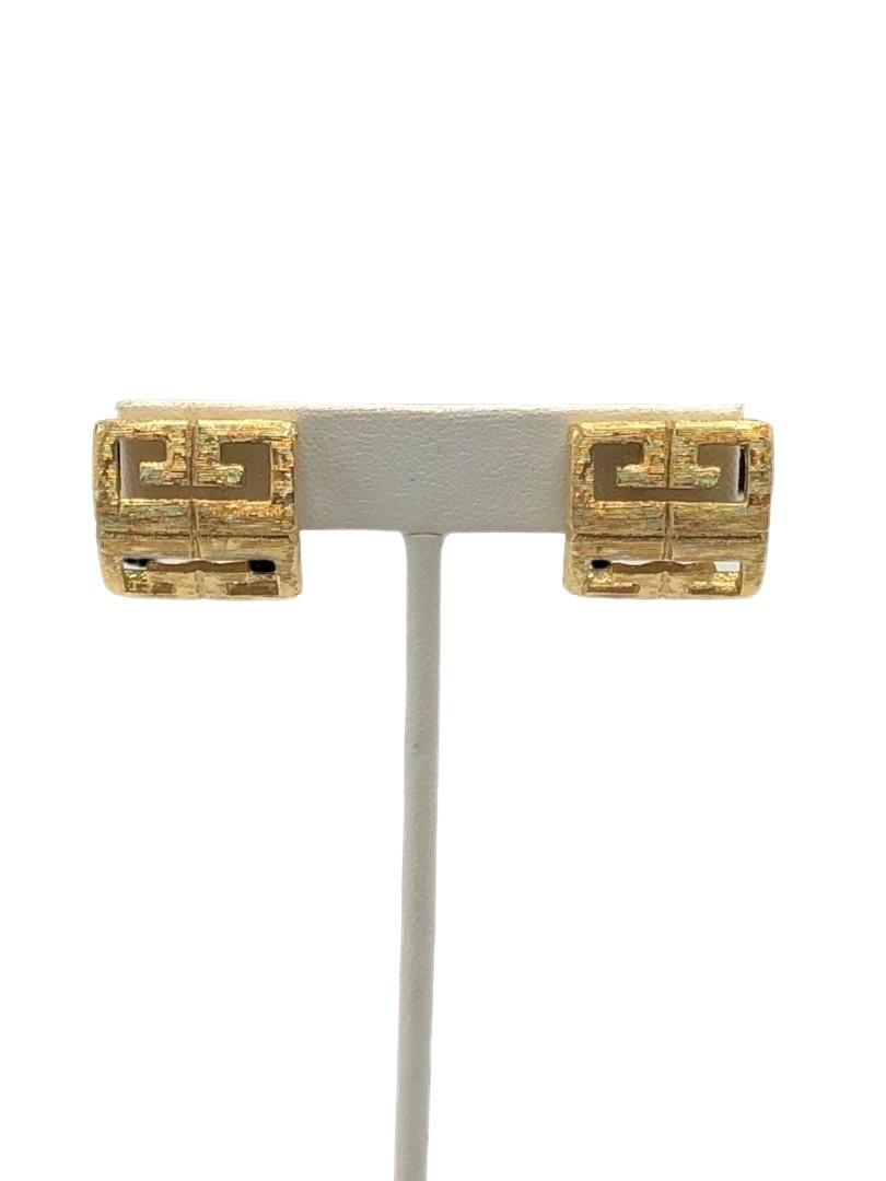 Authentic Givenchy Signature Monogram Earrings.: Brand: Givenchy Material: Gold-plated Style: EarringsPierced HallMark: "Givenchy" Country of Origin: France All Bidhaus items come with a 100% money-back authenticity guarantee. ALL SALES ARE FINAL. P
