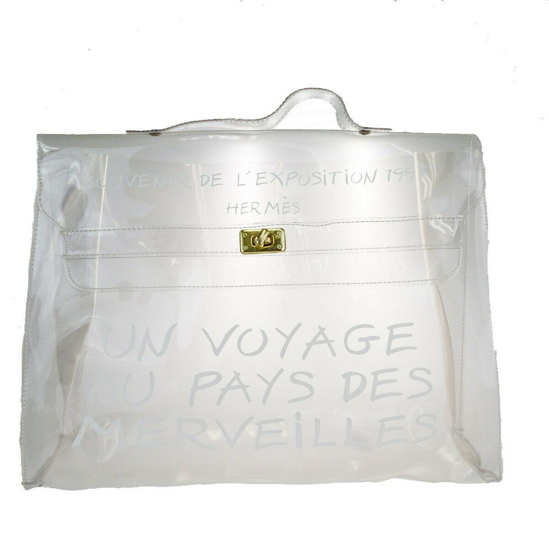 Authentic HERMES KELLY 40 Vinyl Hand Bag: Brand: HERMES Material: Vinyl Style: Hand Bag Color: Clear Size(inch): W 15.7 x H 11.4 x D 4.3"(approx.) Country of Origin: - Come with: - All Bidhaus items come with a 100% money-back authenticity gu