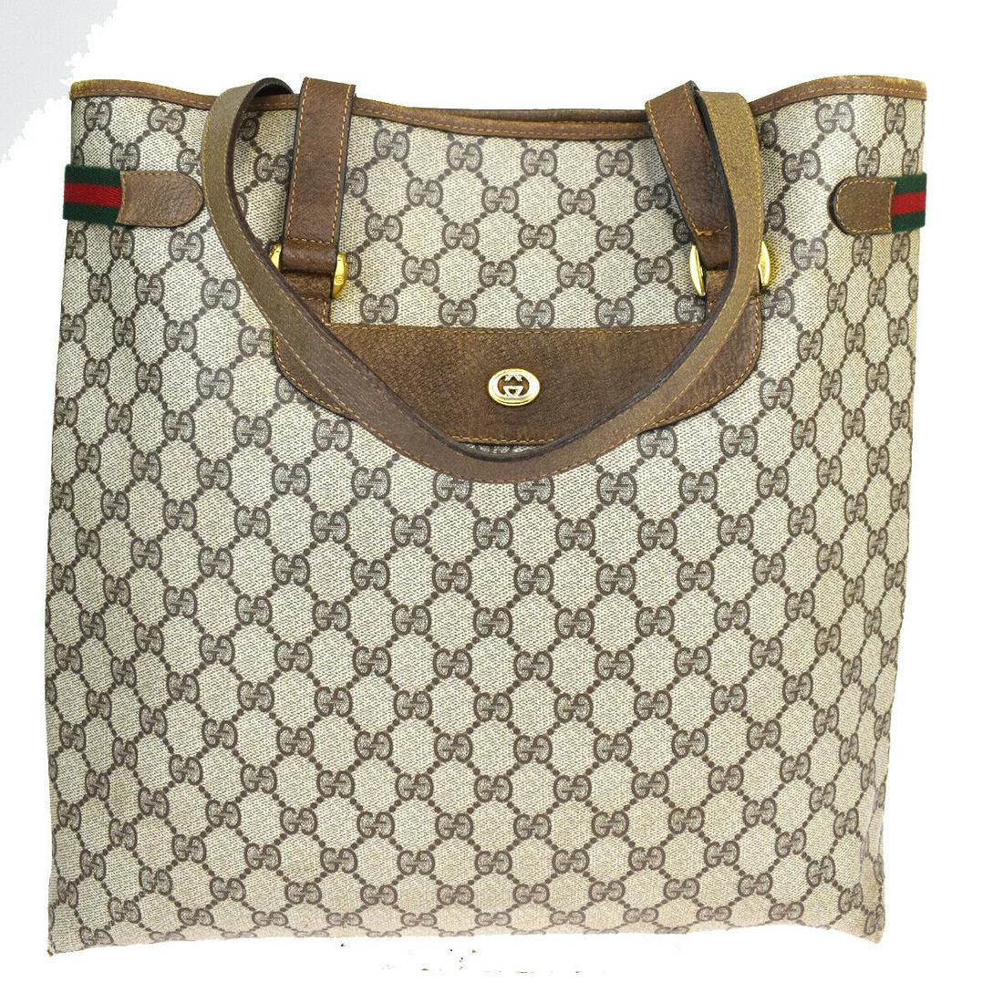 Authentic GUCCI PVC,Leather Shoulder Bag: Brand: GUCCI Material: PVC,Leather Style: Shoulder Bag Color: Brown Size(inch): W 14.2 x H 14.6 x D 3.5 "(approx.) Country of Origin: Italy Come with: - All Bidhaus items come with a 100% money-back a