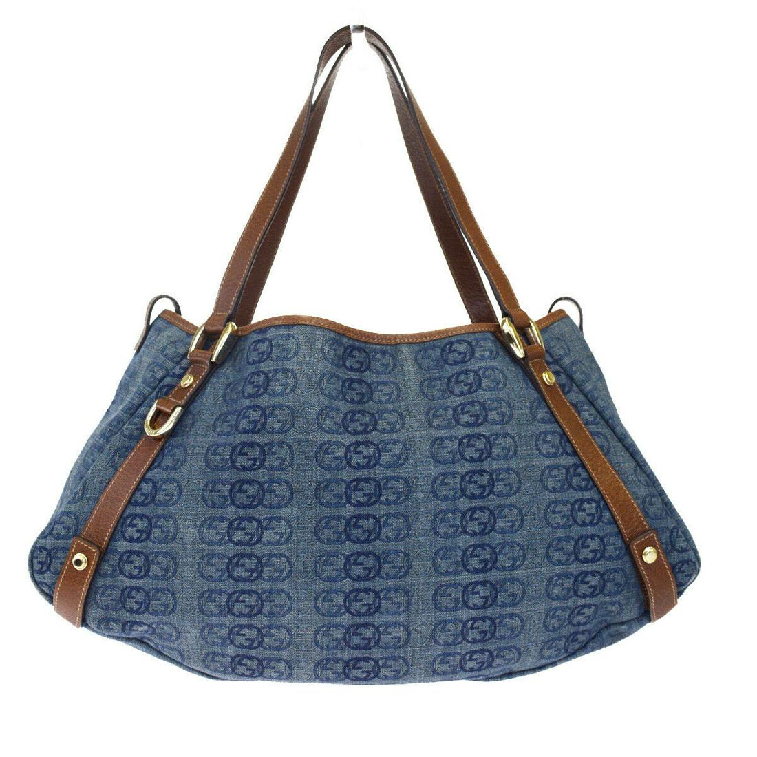 Authentic GUCCI Canvas Leather Shoulder Bag: Brand: GUCCI Material: Canvas Leather Style: Shoulder Bag Color: Brown Size(inch): W 15.7 x H 9.4 x D 3.9"(approx.) Country of Origin: Italy Come with: - All Bidhaus items come with a 100% money-back 