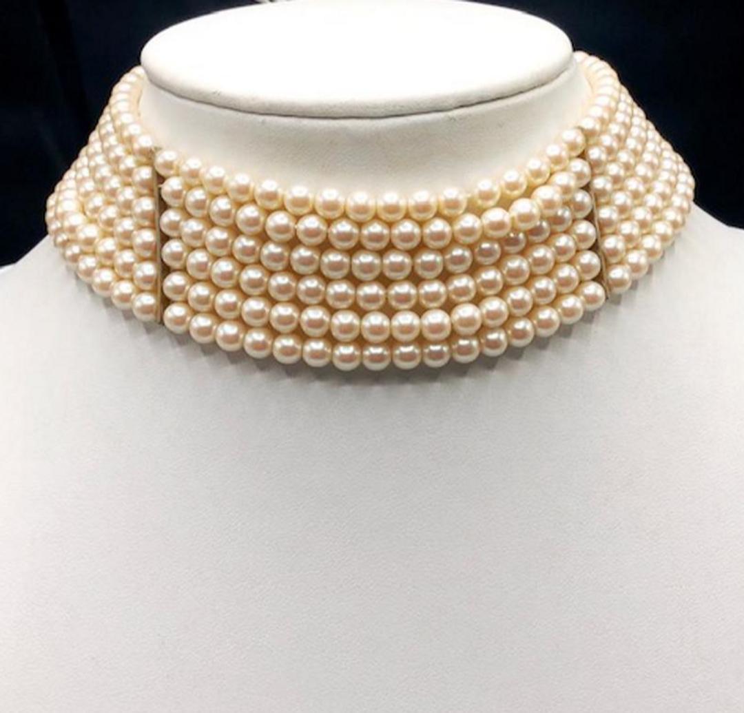 Authentic Givenchy Multi Strand Simulated Pearl Choke.: Brand: Givenchy Material: Simulated Pearl Style: Chain Dimensions(inch) : 12 L x 1.5 W ( additional 3.25 extension)Detail: HallMark : Givenchy logo Country of Origin: France All Bidhaus items come wit