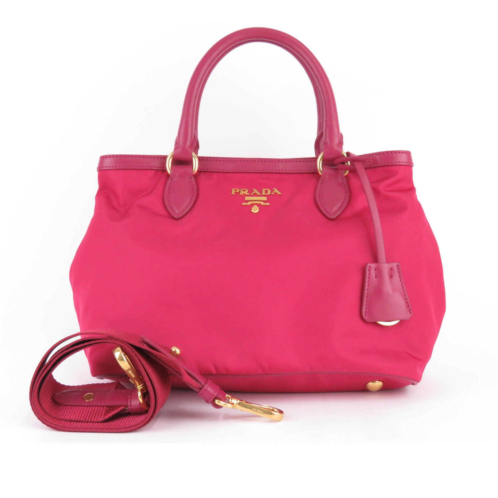 Authentic Prada Tessuto Satchel: This satchel features a nylon body, rolled leather handles, a detachable flat strap, a top magnetic snap button closure, and interior zip and slip pockets.Brand: Prada Model: Tessuto Satchel Origin: I