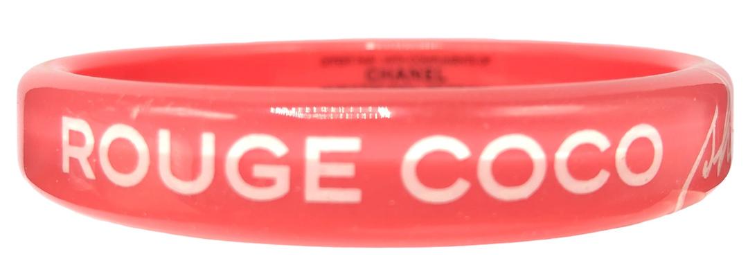 Authentic Coco Chanel Pink Promotional Bangle.: Brand: Chanel Category: Bracelet Fastening: Style: Bangle Materials: plastic Size: Hallmark: Other Remarks: Not sold, promo bangle All Bidhaus items come with a 100% money-back authenticity guarantee.