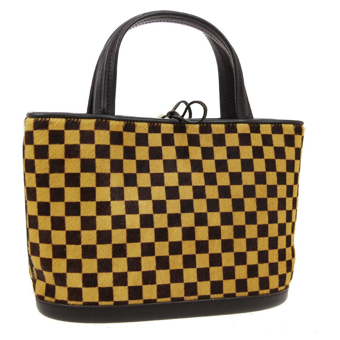 Authentic LOUIS VUITTON Fur, Leather Hand Bag: Brand: LOUIS VUITTON Material: Fur, Leather Style: Hand Bag Color: Brown Size(inch): W7.8 x H5.7 x D3.5 " / Strap Drop: 3.1 Size(inch): W 7.8x H 5.7 x D 3.5"Handle Drop. 3.1" Country of Origin: Italy