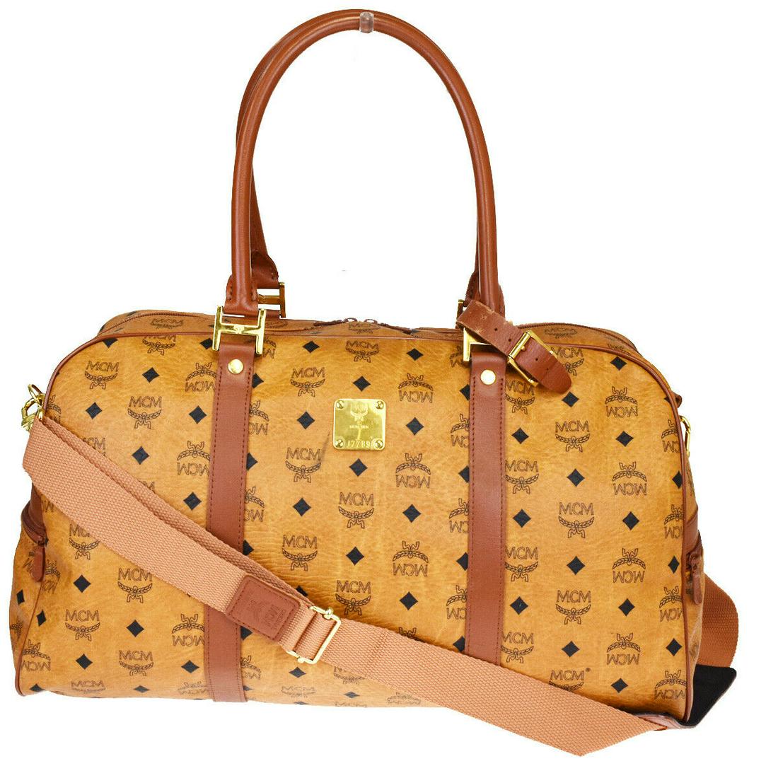 Authentic MCM Leather Shoulder Bag: Brand: MCM Material: Leather Style: Shoulder Bag Color: Brown Size(inch): W 18.9 x H 13 x D 10.2 "(approx.) Country of Origin: Germany Come with: Shoulder strap,Handle holder All Bidhaus items come wi