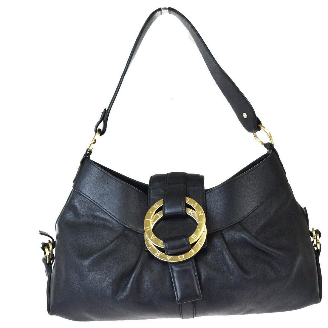 Authentic BVLGARI Leather Shoulder Bag: Brand: BVLGARI Material: Leather Style: Shoulder Bag Color: Black Size(inch): W 13.8 x H 7.5 x D 4.7 "(approx.) Country of Origin: Italy Come with: - All Bidhaus items come with a 100% money-back auth