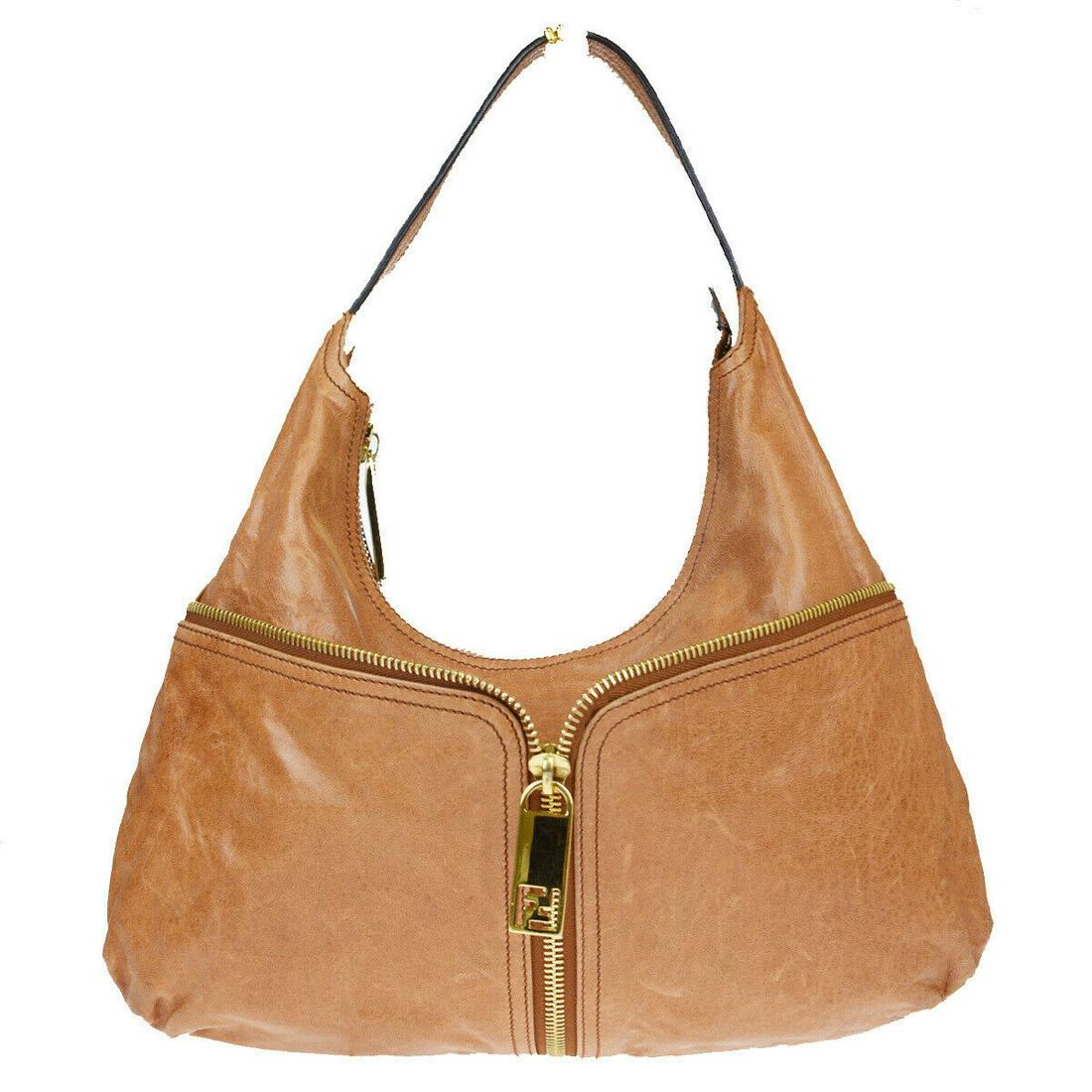 Authentic FENDI Leather Shoulder Bag: Brand: FENDI Material: Leather Style: Shoulder bag Color: Brown Size (HxWxD): 24cm x 38cm x 3.5cm / 9.44'' x 14.96'' x 1.37'' Country of Origin: Italy All Bidhaus items come with a 100% money-back aut