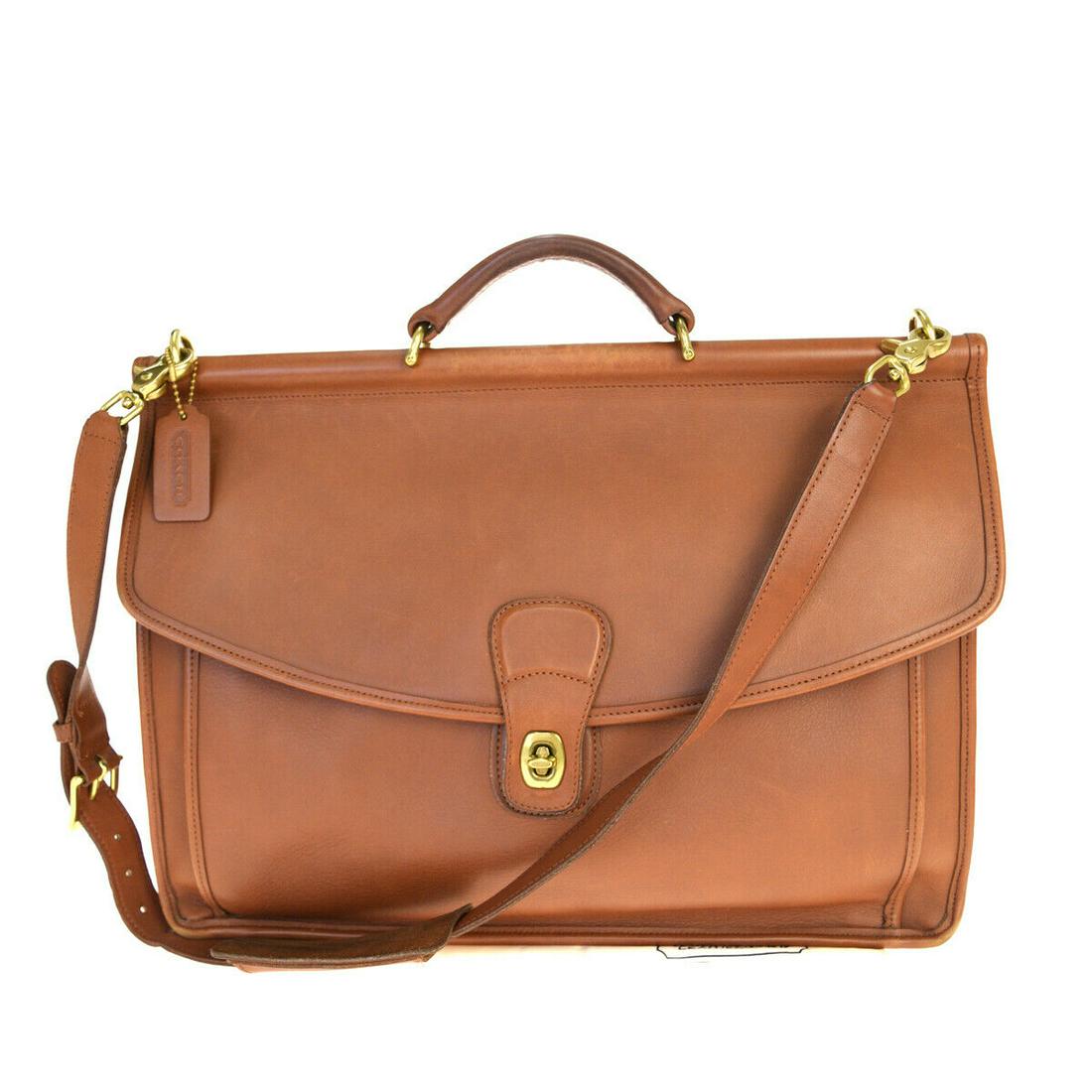 Authentic COACH Leather Briefcase: Brand: COACH Material: Leather Style: Briefcase Color: Brown Size (HxWxD): 31cm x 41cm x 12cm / 12.2'' x 16.14'' x 4.72'' Country of Origin: Unknown All Bidhaus items come with a 100% money-back authe