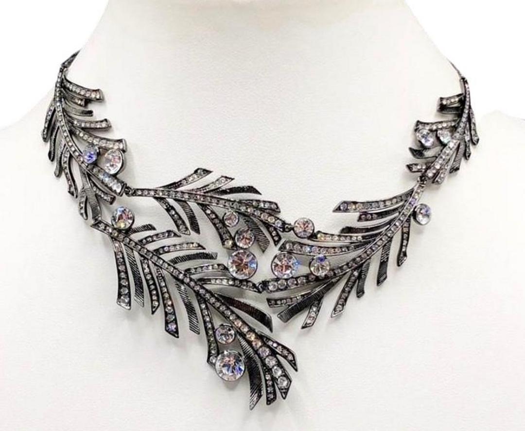 Authentic Givenchy Gunmetal Leaf Necklace W/ Swaroski: Brand: Givenchy Material: Gun Metal Style: Necklace Color: Black Clasp: Marquise shaped with jump ring Stone: Swaroski Crystal Diameter(inch): 16 L (Additional 3' extender) = 19" Bib(inch): 7 L x 2.75