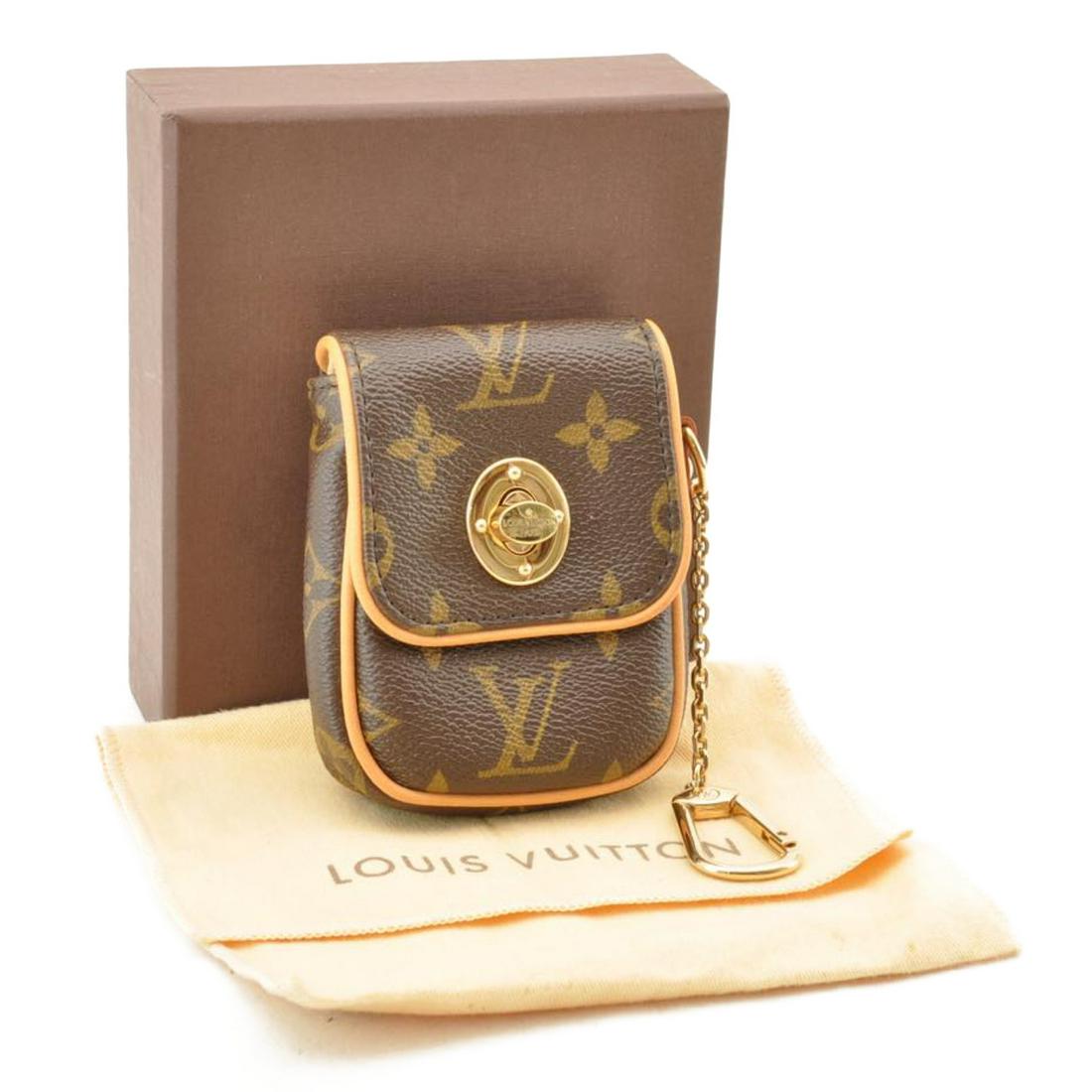 Authentic LOUIS VUITTON TULUM Monogram Canvas Pouch: Brand: LOUIS VUITTON Material: Monogram Canvas Style: Pouch Color: Monogram Size(inch): W3.14 x H3.93 x D1.18inch(Approx) Country of Origin: France Accessory: Dust Bag / Item Box / Instruction Manual