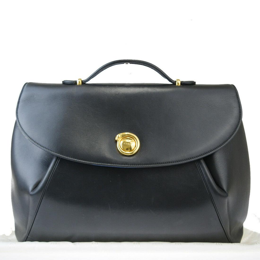 Authentic CARTIER Leather hand bag: Brand: CARTIER Material: Leather Style: hand bag Color: Black Size(inch): W 14.2 x H 10.2 x D 2 "(approx.) Country of Origin: - Come with: - All Bidhaus items come with a 100% money-back authenticity