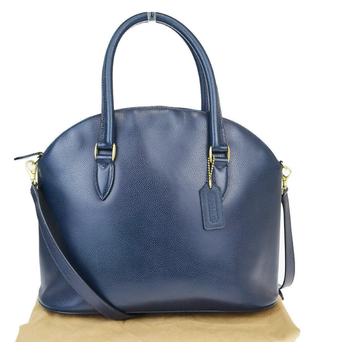 Authentic COACH Leather Handbag: Brand: COACH Material: Leather Style: Handbag Color: Navy Size (HxWxD): 26.5cm x 33cm x 13.5cm / 10.43'' x 12.99'' x 5.31'' Country of Origin: Italy All Bidhaus items come with a 100% money-back authe