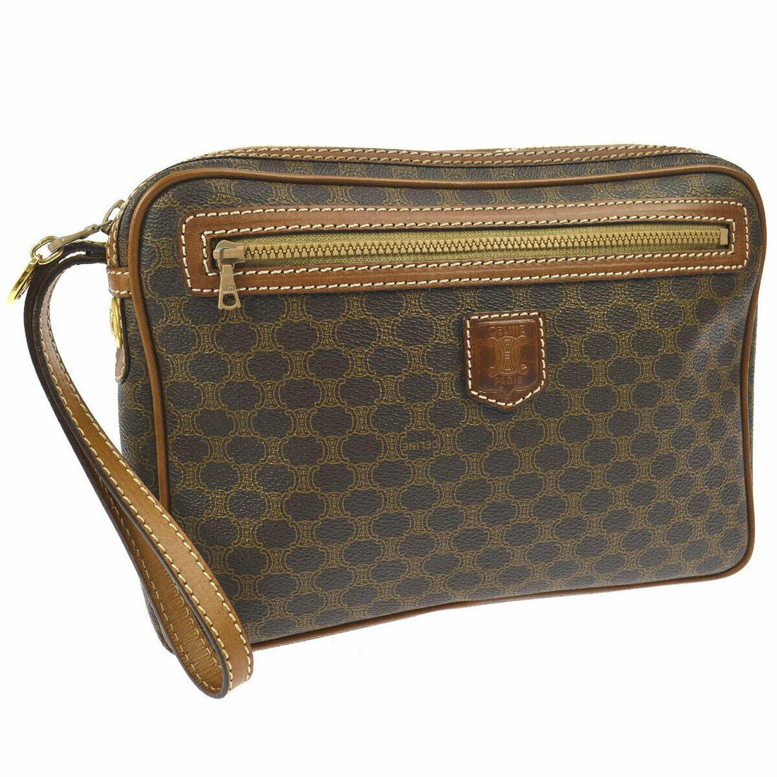 Authentic CELINE PVC, Leather Clutch: Brand: CELINE Material: PVC, Leather Style: Clutch Color: Brown Size(inch): W9.4 x H6.7 x D1.6 " Size(inch): W 9.4 x H 6.7 x D 1.6 " Country of Origin: Italy Come with: - All Bidhaus items come with a