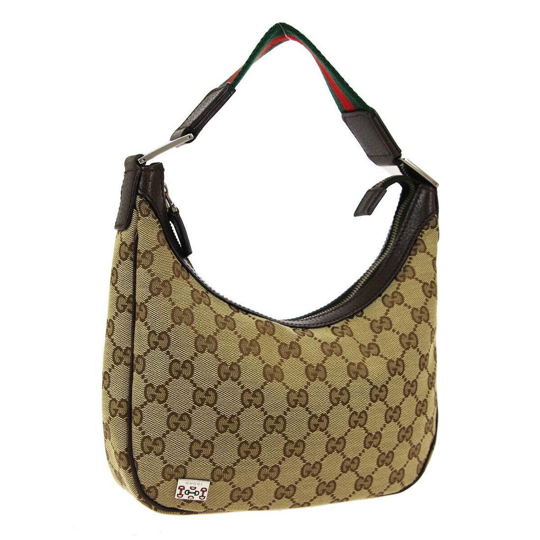 Authentic GUCCI Canvas,Leather Hand Bag: Brand: GUCCI Material: Canvas,Leather Style: Hand Bag Color: Brown, Red, Green Size(inch): W9.1 x H5.7 x D2.0 " Size(inch): W 9.1 x H 5.7 x D 2.0 "Strap Drop. 7.1 " Country of Origin: Italy Come with: