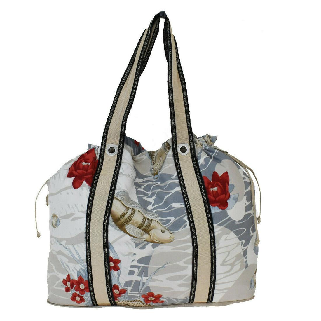 Authentic SALVATORE FERRAGAMO Nylon Shoulder Bag: Brand: SALVATORE FERRAGAMO Material: Nylon Style: Shoulder Bag Color: gray Beige Size(inch): W 15.4 x H 13.4 x D 7.9 "(approx.) Country of Origin: Italy Come with: - All Bidhaus items come with a 100%