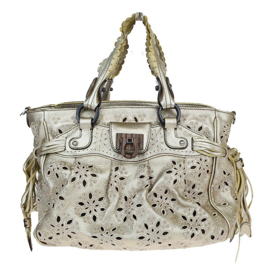 Authentic SALVATORE FERRAGAMO Leather Handbag: Brand: SALVATORE FERRAGAMO Material: Leather Style: Handbag Color: Gold Size (HxWxD): 22cm x 24cm x 10cm / 8.66'' x 9.44'' x 3.93'' Country of Origin: Italy All Bidhaus items come with a 100% money-ba