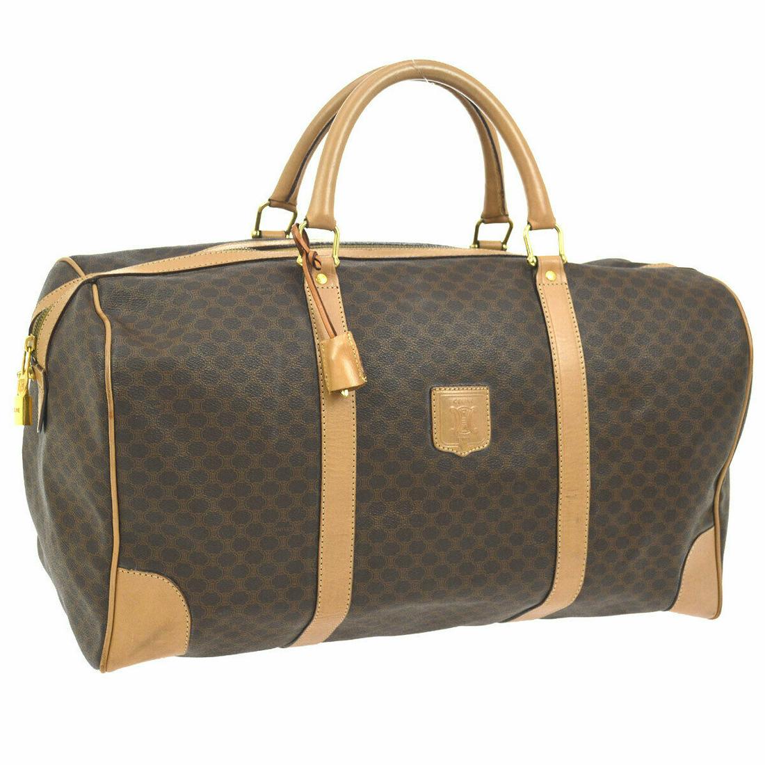 Authentic CELINE PVC, Leather Travel Hand Bag: Brand: CELINE Material: PVC, Leather Style: Travel Hand Bag Color: Brown Size(inch): W19.3 x H11.0 x D9.3 " Size(inch): W 19.3 x H 11.0 x D 9.3 "Handle Drop. 5.5 " Country of Origin: Italy Come with: