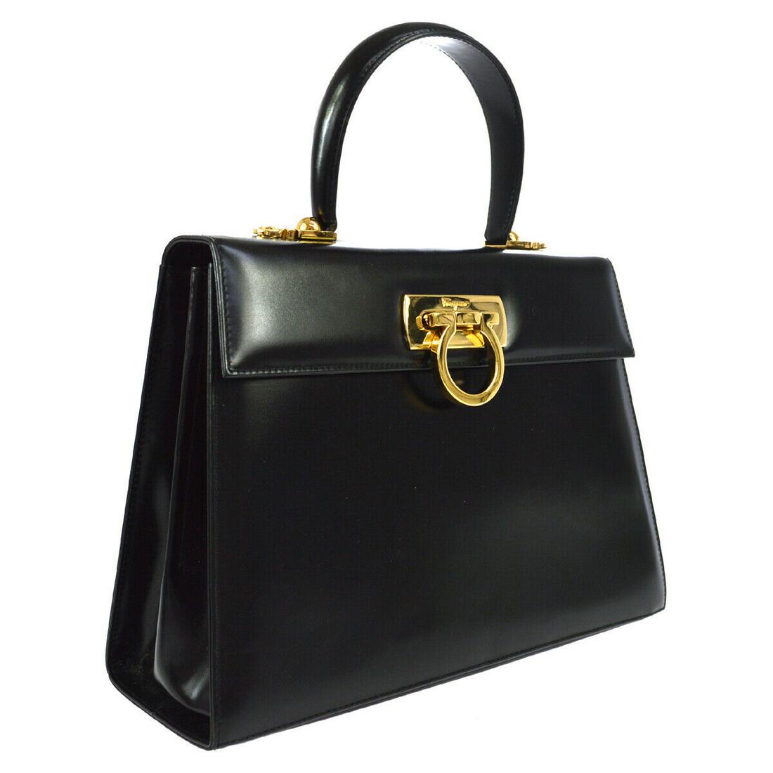 Authentic SALVATORE FERRAGAMO Leather Handbag: Brand: SALVATORE FERRAGAMO Material: Leather Style: Handbag Color: Black Size(inch): W10.2 x H8.3 x D3.9 " / Strap Drop: 18.1 - 20.5 Country of Manufacture: Italy Come with: Shoulder strap, Manual All